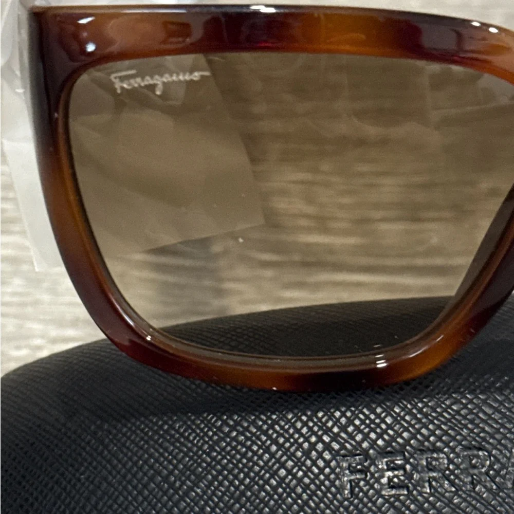 Salvatore Ferragamo Tortoise Sunglasses with SF Logo at Temples.